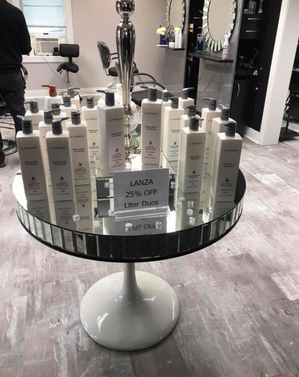 a table with bottles of lanza hair products on it