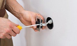 Male Technician Fixing Socket - Electrical in Irving, TX