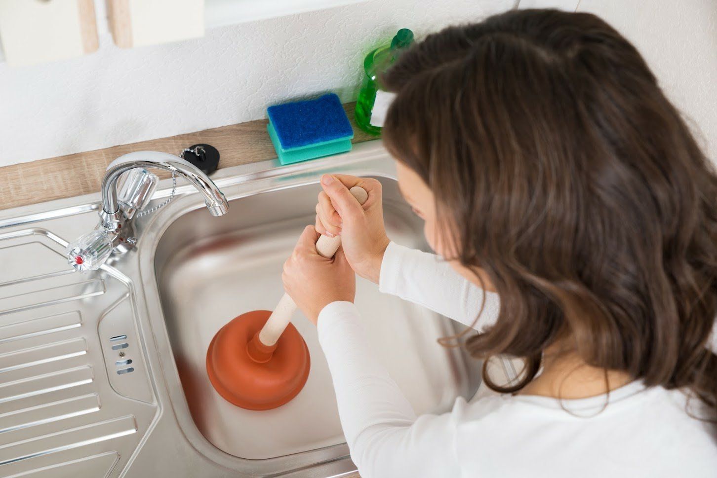 Woman Pumping The Sink — Euless, TX — Henry's Service All