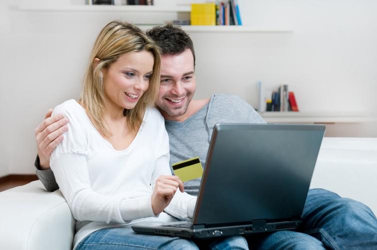 Couple Looking at Laptop — Electrician in Irving, TX