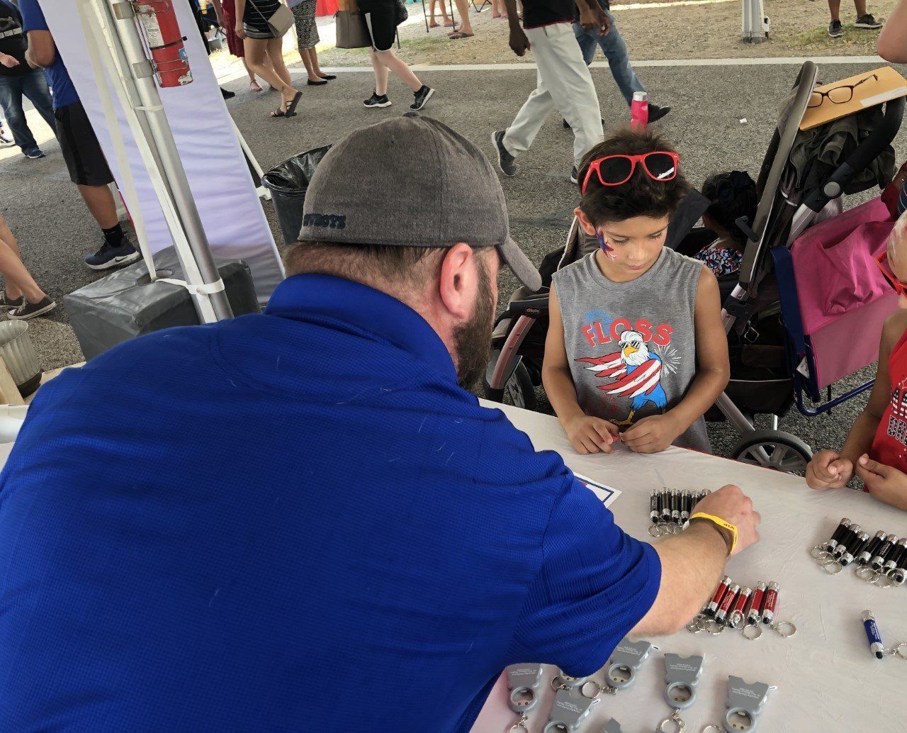 Plumbing Contractors — Matt Talking to a Kid in Irving, TX