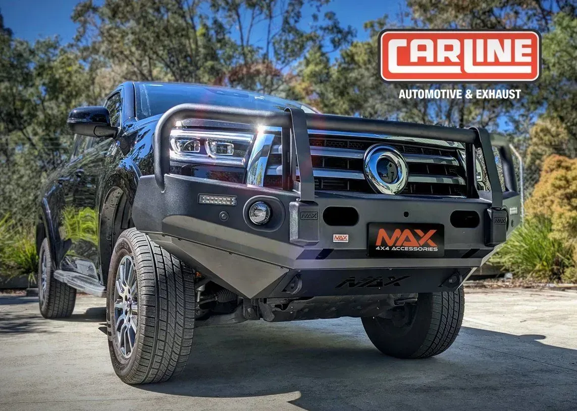 Black Off-road Truck With a Bull Bar in Front of Foliage — Carline Automotive and Exhausts in Belmont, NSW
