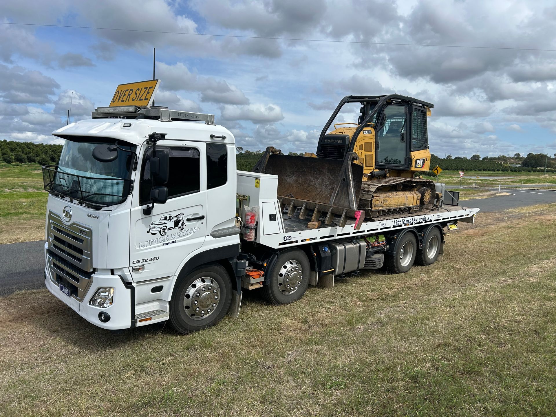 A White Suv Is Being Towed By A Tow Truck — Little Mates Towing & Transport Pty Ltd In Emerald, QLD
