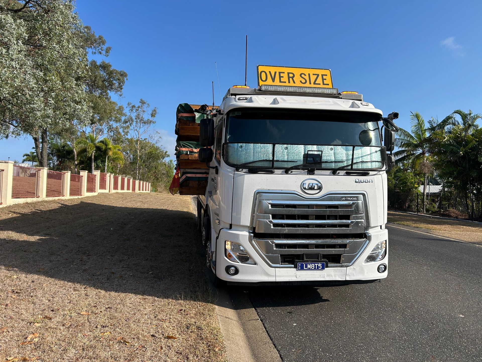A Tow Truck Is Towing A Car On A Ramp — Little Mates Towing & Transport Pty Ltd In Yeppoon, QLD