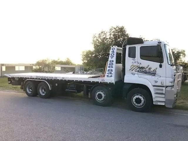 A White Tow Truck Is Parked On The Side Of The Road — Little Mates Towing & Transport Pty Ltd In Yeppoon, QLD