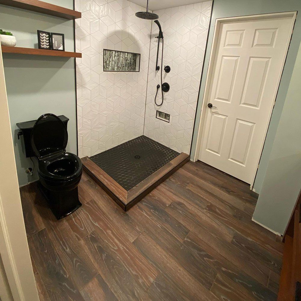 Black Toilet In Bathroom — Forrest, IL — Finishing Touch