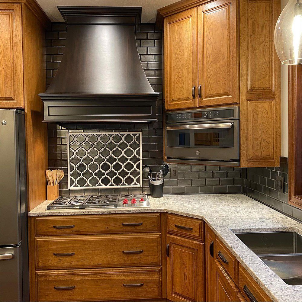 Kitchen With Brown Wooden Cabinets — Forrest, IL — Finishing Touch