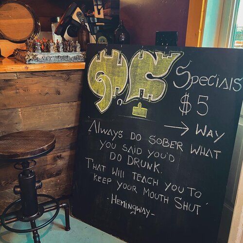 A chalkboard sign that says 95 specials $ 5 way