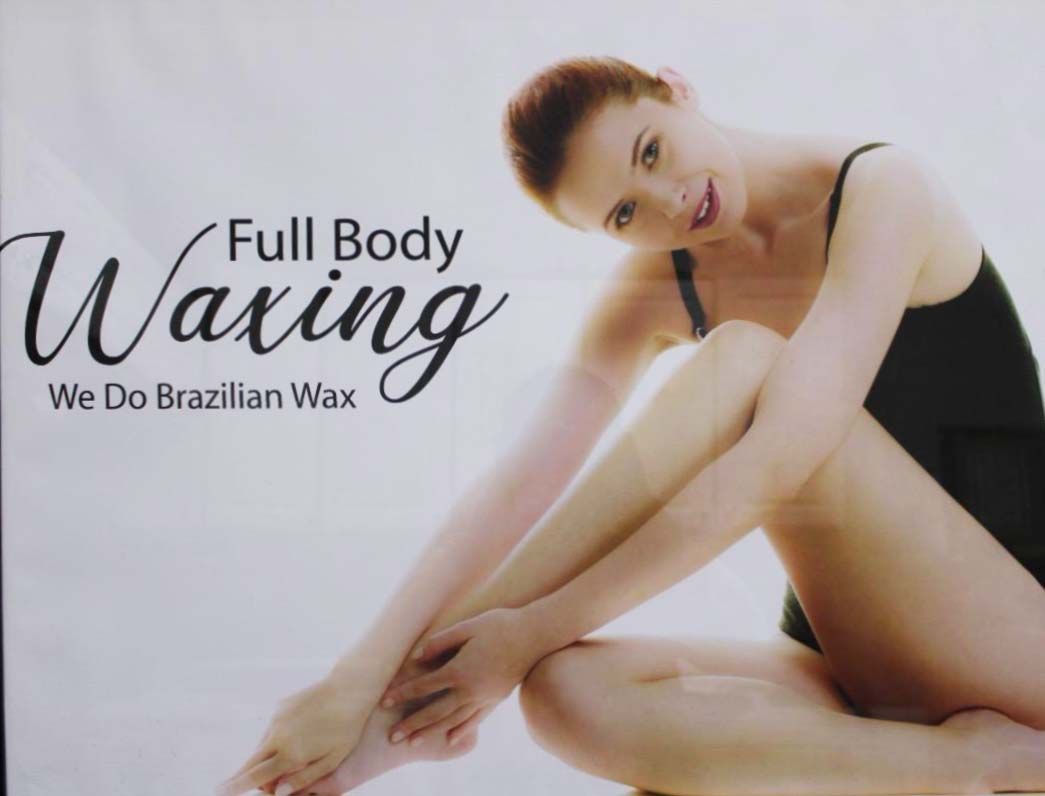 Woman seated, leans forward, showing legs. Text says 