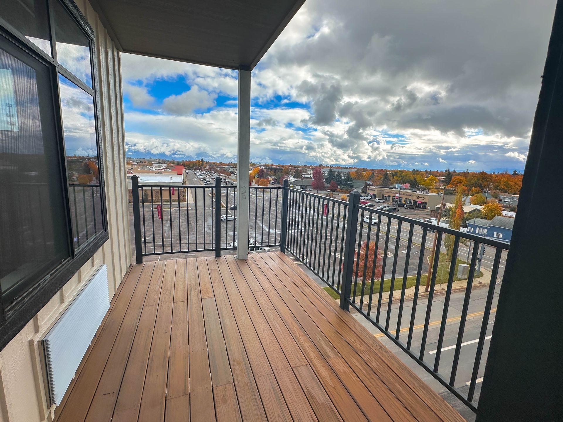 a balcony with a view of a city in the distance
