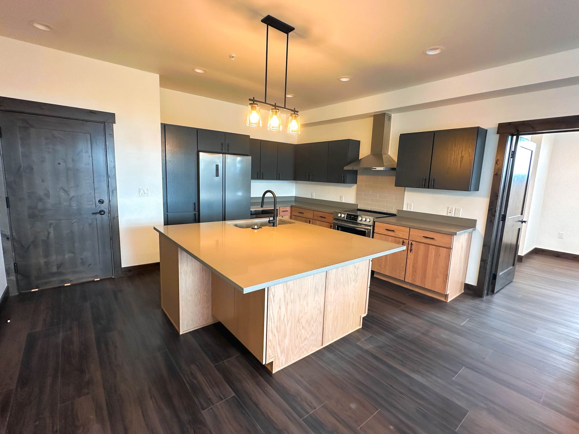 a kitchen with a large island in the middle