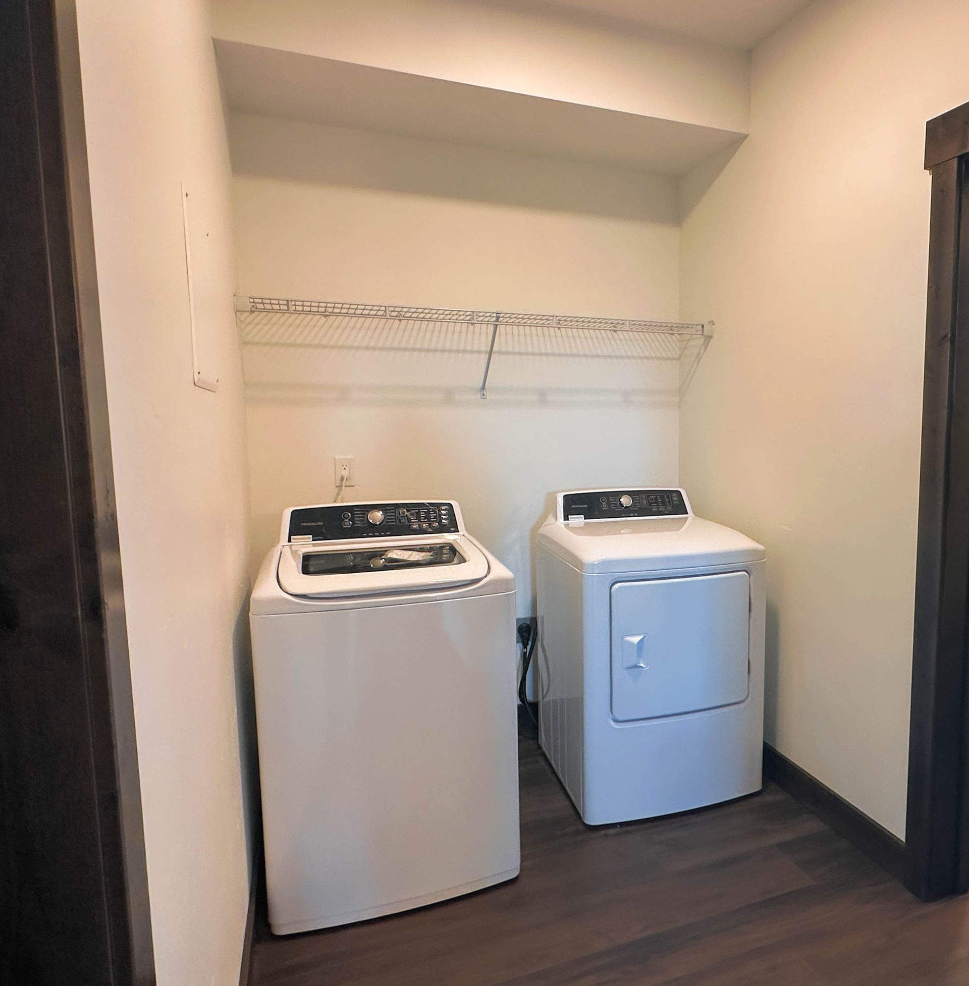 a white washer and dryer in a laundry room