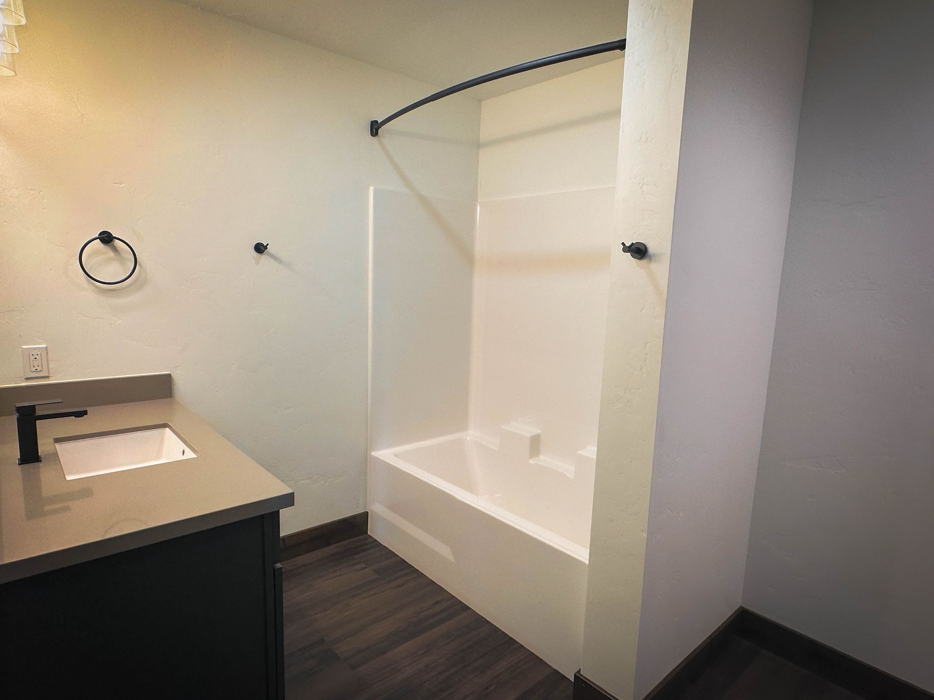 a bathroom with a bathtub and a sink