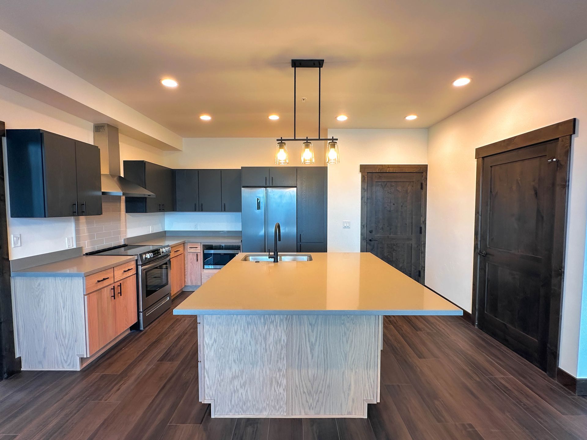 a kitchen with a large island in the middle