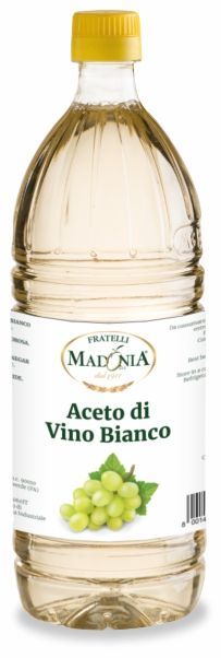 Una bottiglia di aceto di vino bianco con tappo giallo