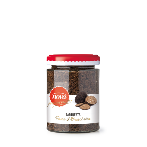 Un barattolo di crema al tartufo con un coperchio rosso su uno sfondo bianco.