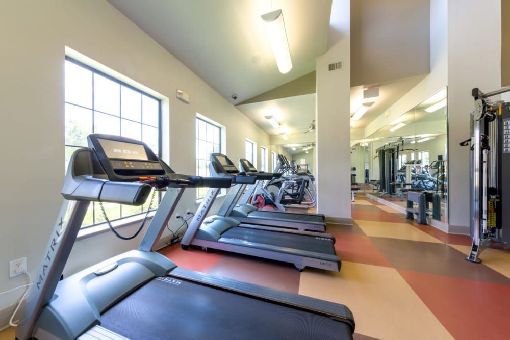 A row of treadmills are lined up in the fitness center at Marquis at Sugar Land in Sugar Land, TX.