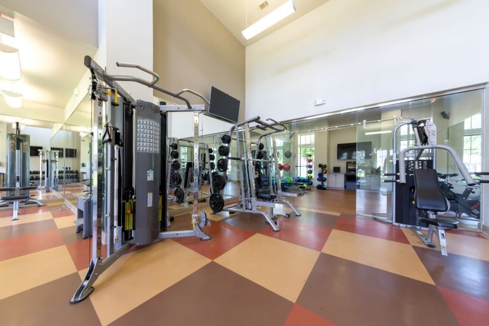Spacious fitness center filled with lots of exercise equipment at Marquis at Sugar Land in Sugar Land, TX.