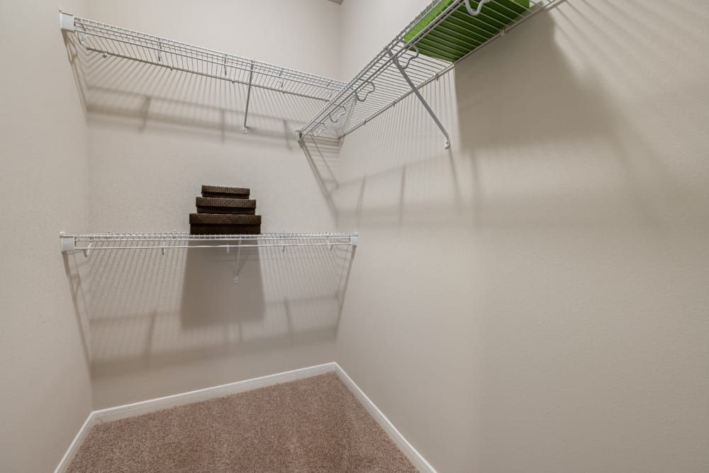 A walk-in closet with lots of space at Marquis at Sugar Land in Sugar Land, TX.
