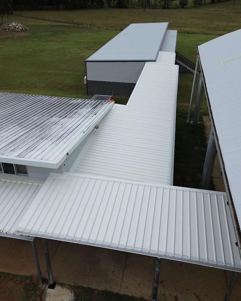 Overhead View of White Metal-roofed Buildings — Ace1 Metal Roofing in Port Macquarie, NSW