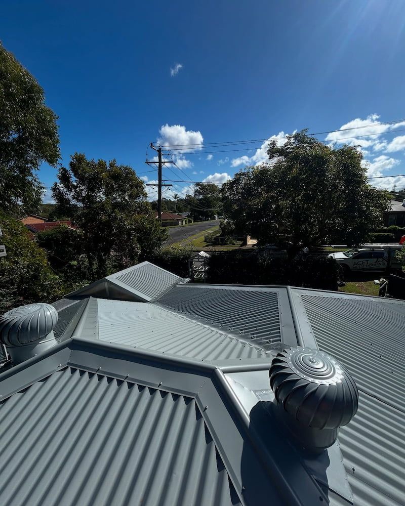 Rooftop View With Two Turbine Vents — Ace1 Metal Roofing in Diamond Beach, NSW