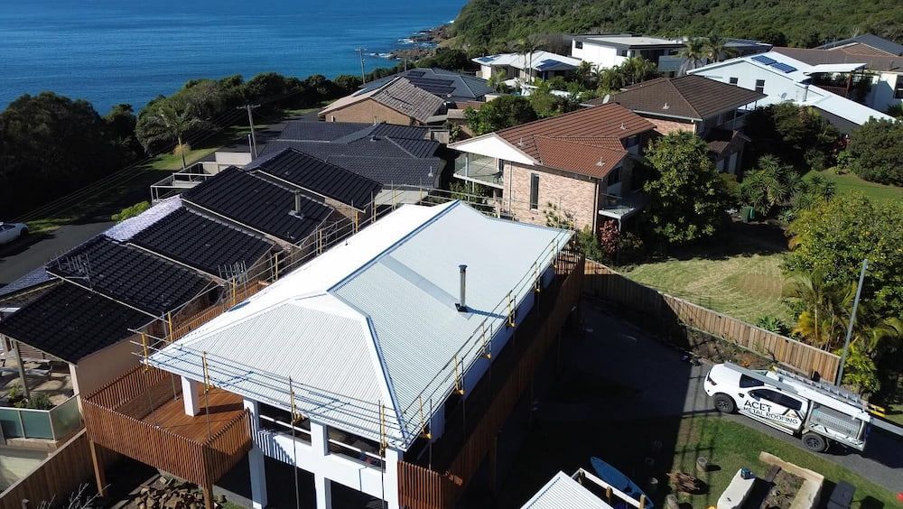 An Aerial View of a White House — Ace1 Metal Roofing in Taree, NSW