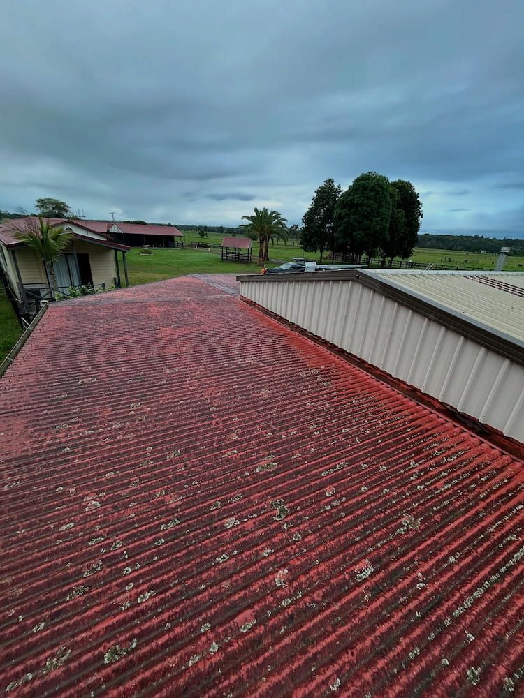 Red Corrugated Roof With Algae, Overcast Day — Ace1 Metal Roofing in Diamond Beach, NSW