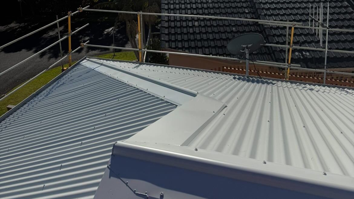Rooftop With Corrugated Metal, Safety Railing, and Antennas — Ace1 Metal Roofing in Wauchope, NSW