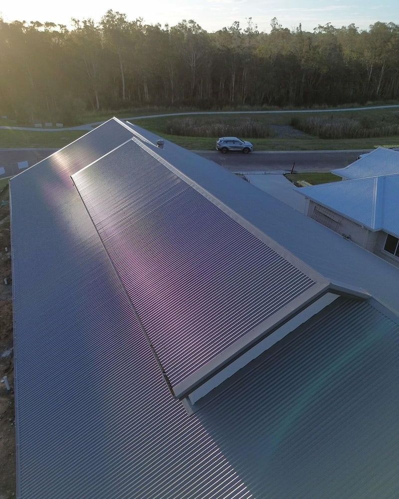 Aerial View of a House With a Corrugated Metal Roof — Ace1 Metal Roofing in Taree, NSW