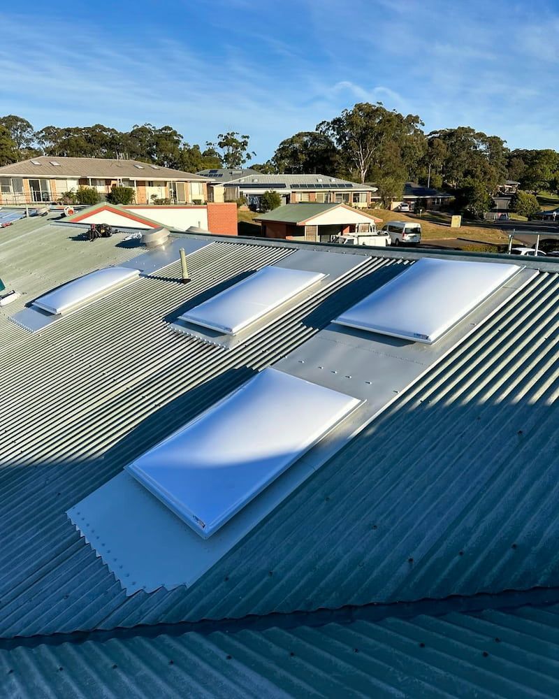 White Skylights on a Corrugated Metal Roof — Ace1 Metal Roofing in Wauchope, NSW