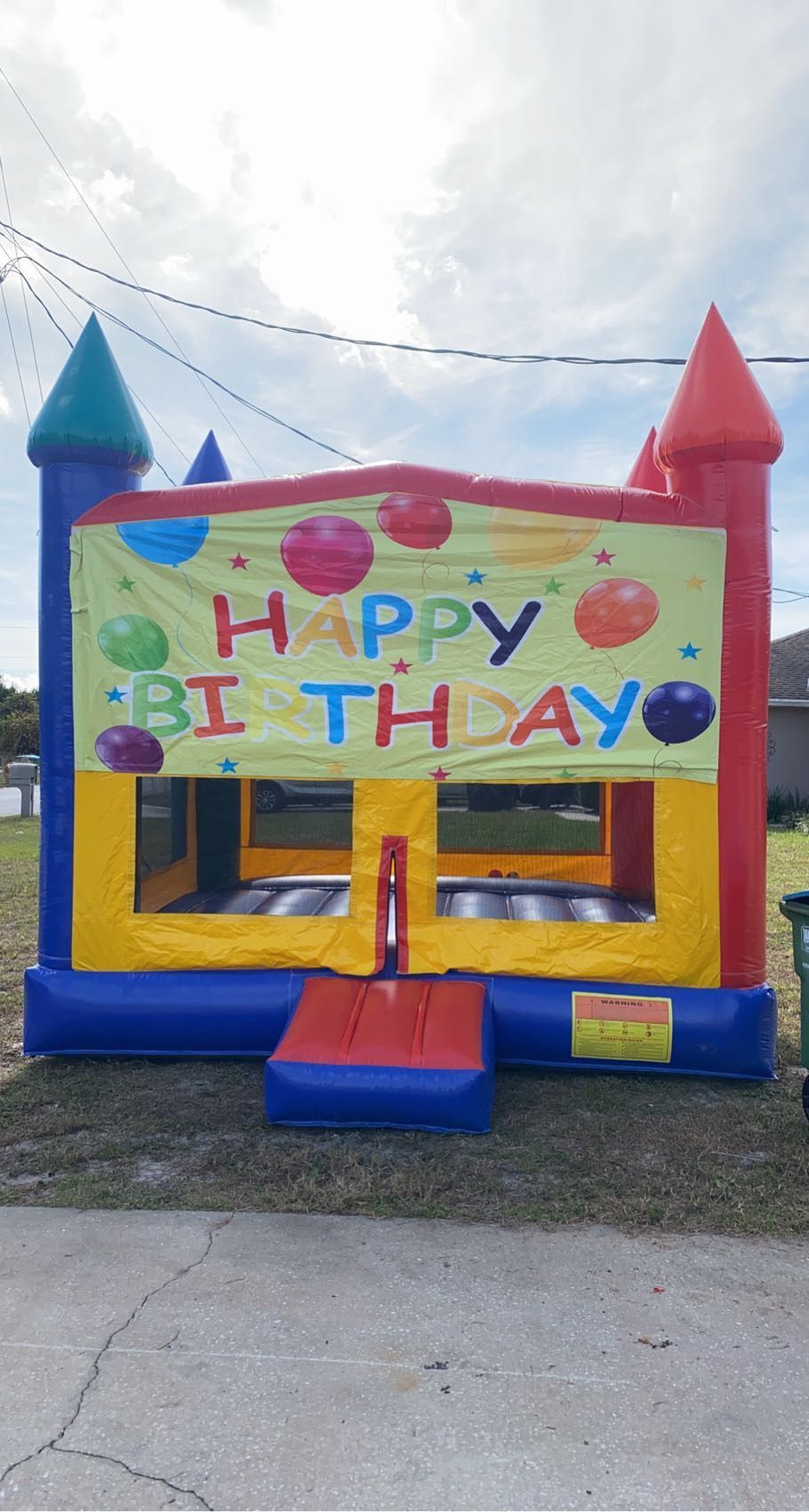 A colorful inflatable bounce house with a 