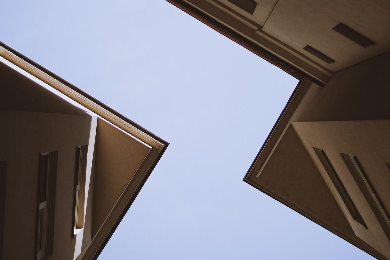 Looking up at a building with a blue sky in the background