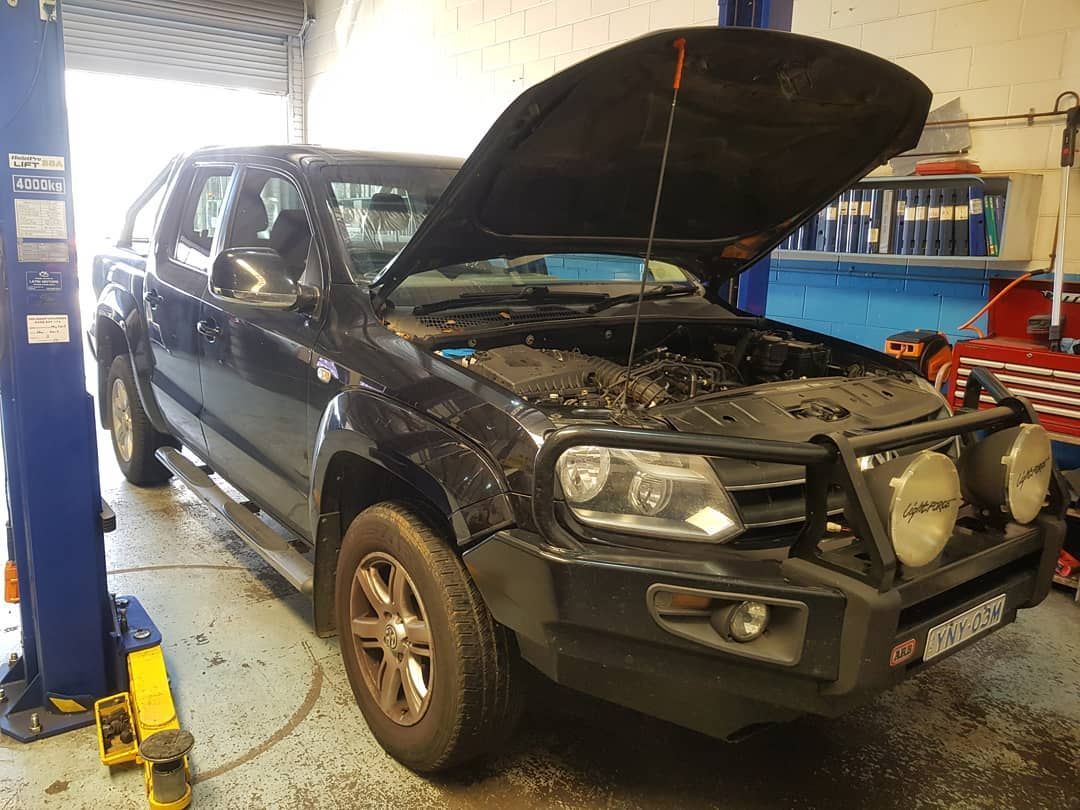 Car Open Engine Hood Inside the Garage — Latin Motors in Fyshwick, ACT