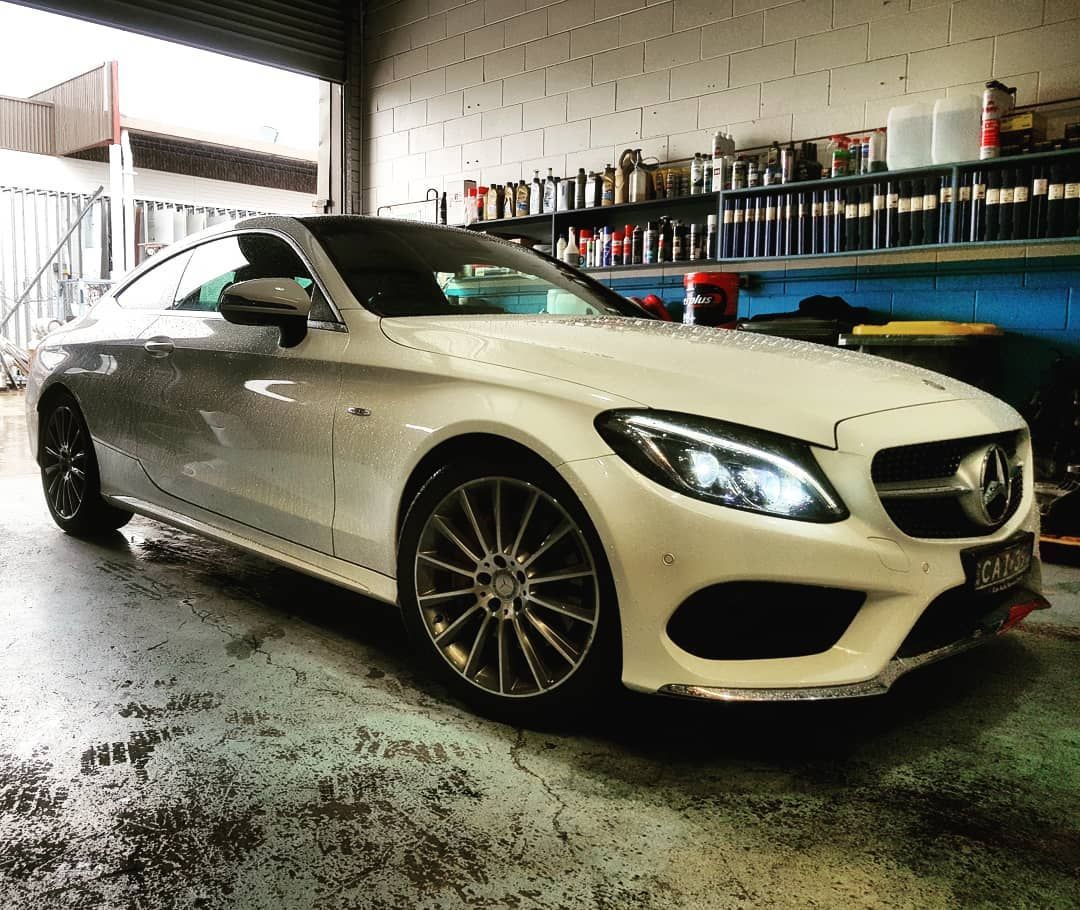 White Luxury Car inside the Garage — Latin Motors in Fyshwick, ACT