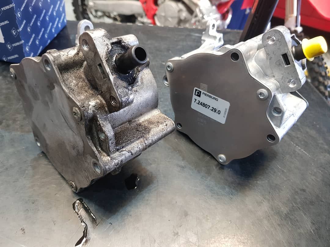 Two Vacuum Pumps Are Sitting Next to Each Other on A Table — Latin Motors in Fyshwick, ACT