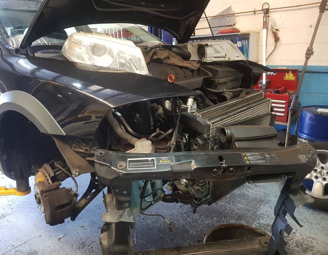 A Black Car with The Hood up Is Being Worked on In a Garage — Latin Motors in Fyshwick, ACT
