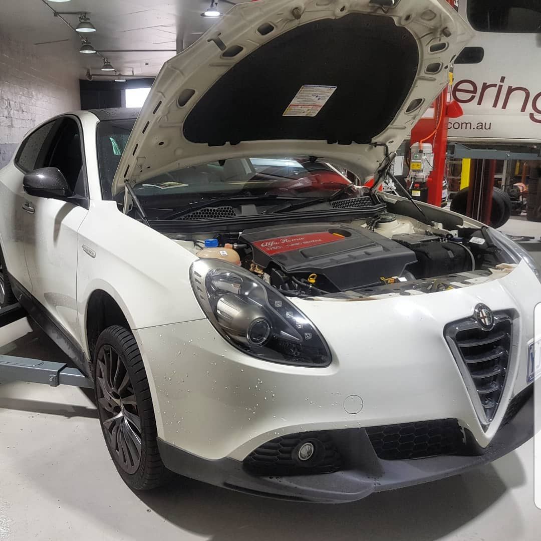 A White Car with The Hood up In a Garage — Latin Motors in Fyshwick, ACT