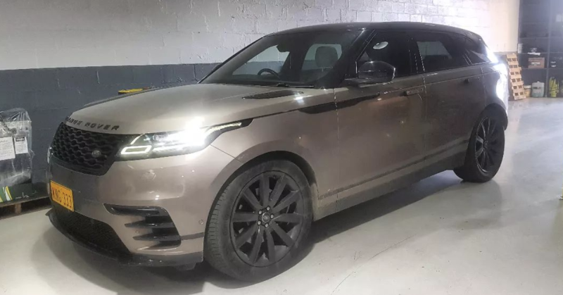 A Range Rover Velar Is Parked in A Garage — Latin Motors in Fyshwick, ACT