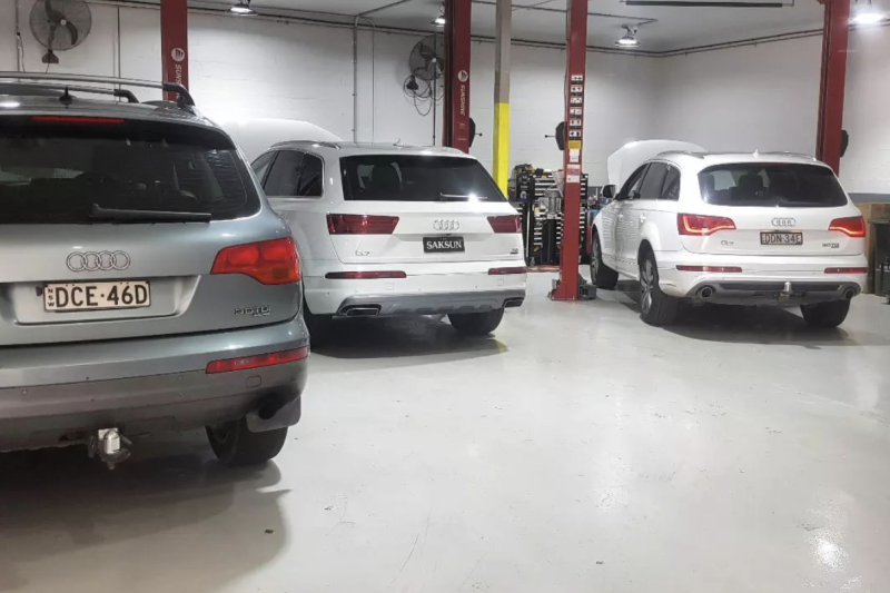 A Row of Cars Are Parked in A Garage — Latin Motors in Fyshwick, ACT