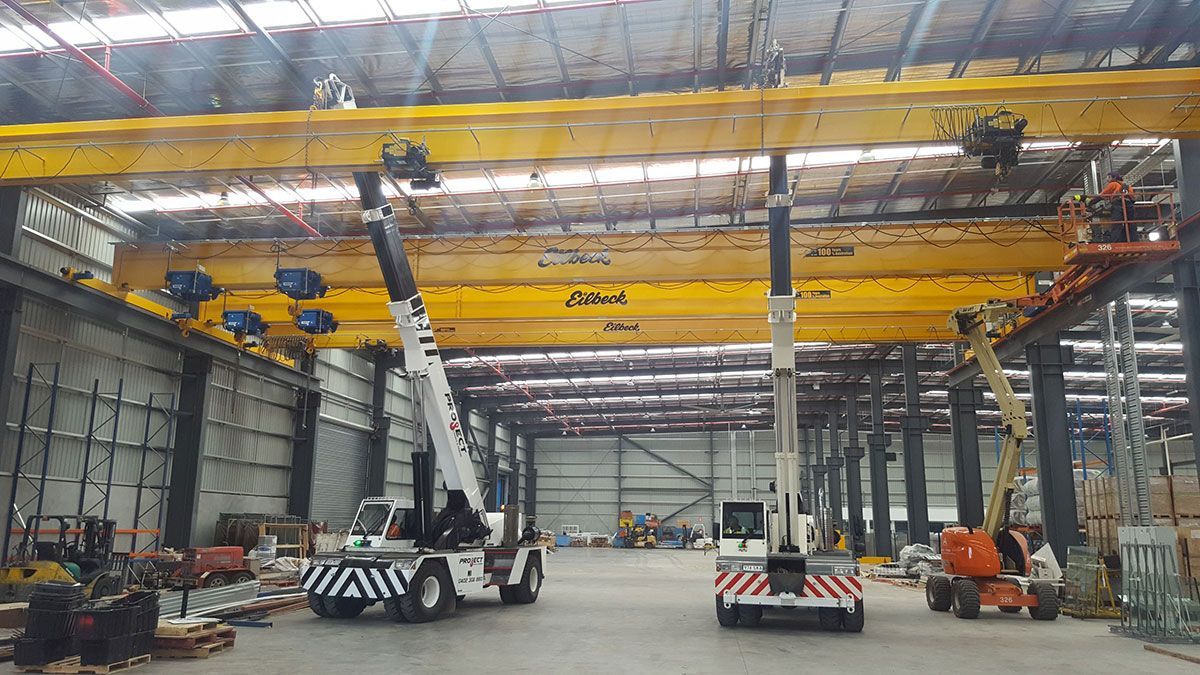A large warehouse with a lot of machinery in it.