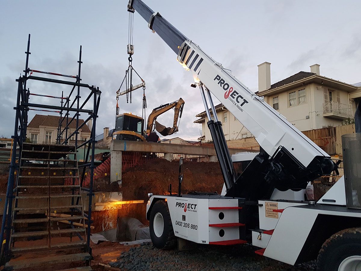 A white crane with the word project on it