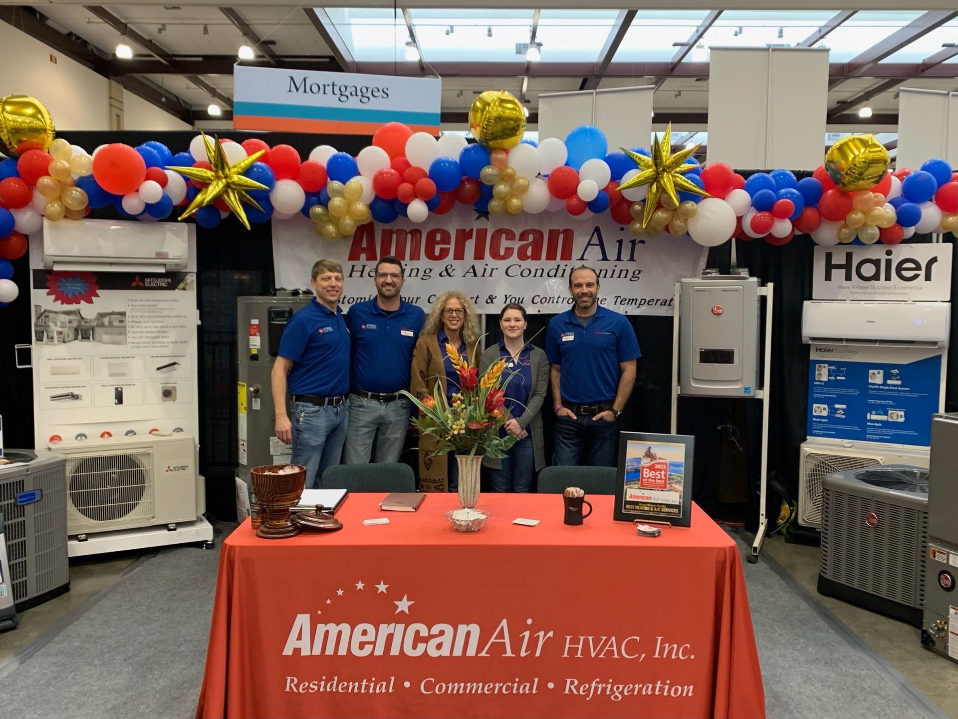 A group of people standing around a table for american air