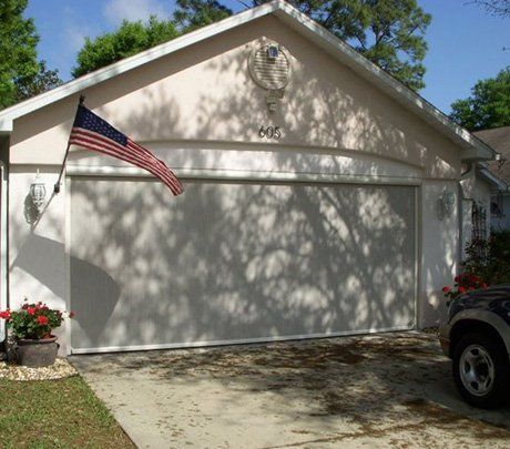 House With American Flag — Ormond Beach, FL — Cypress Head Screens Inc.