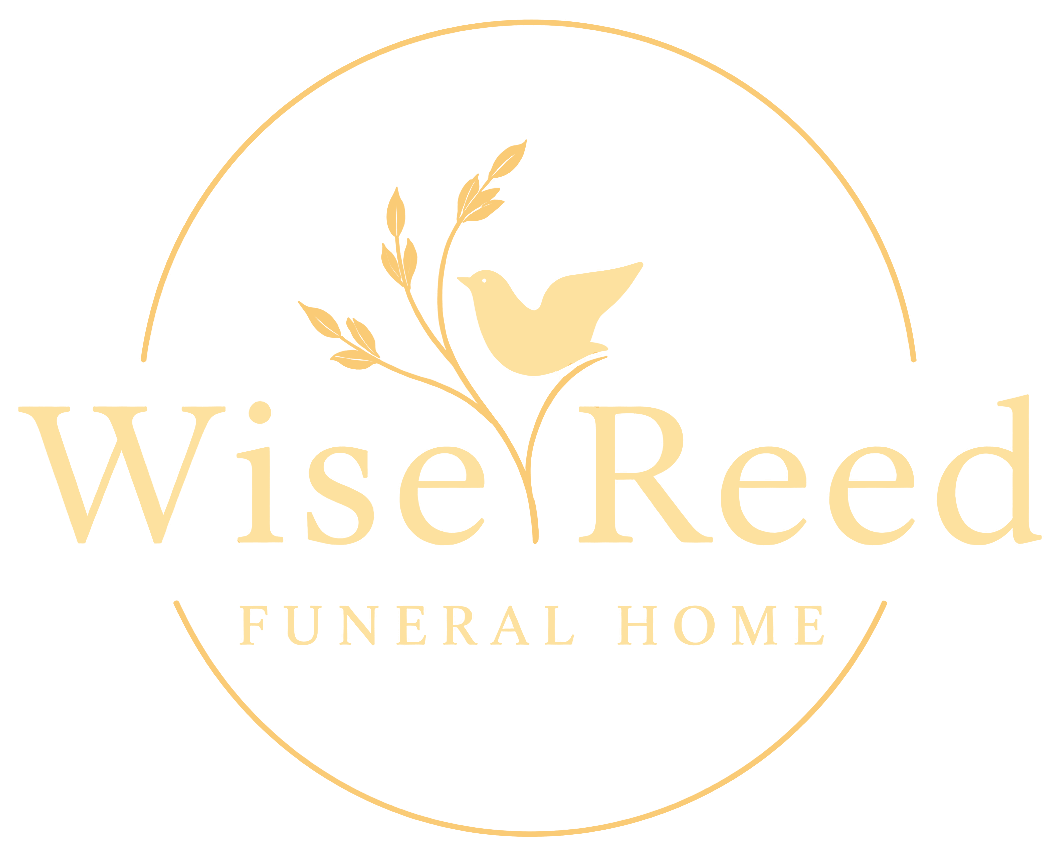 WiseReed Funeral Home logo in gold with bird and floral branches inside a thin circle