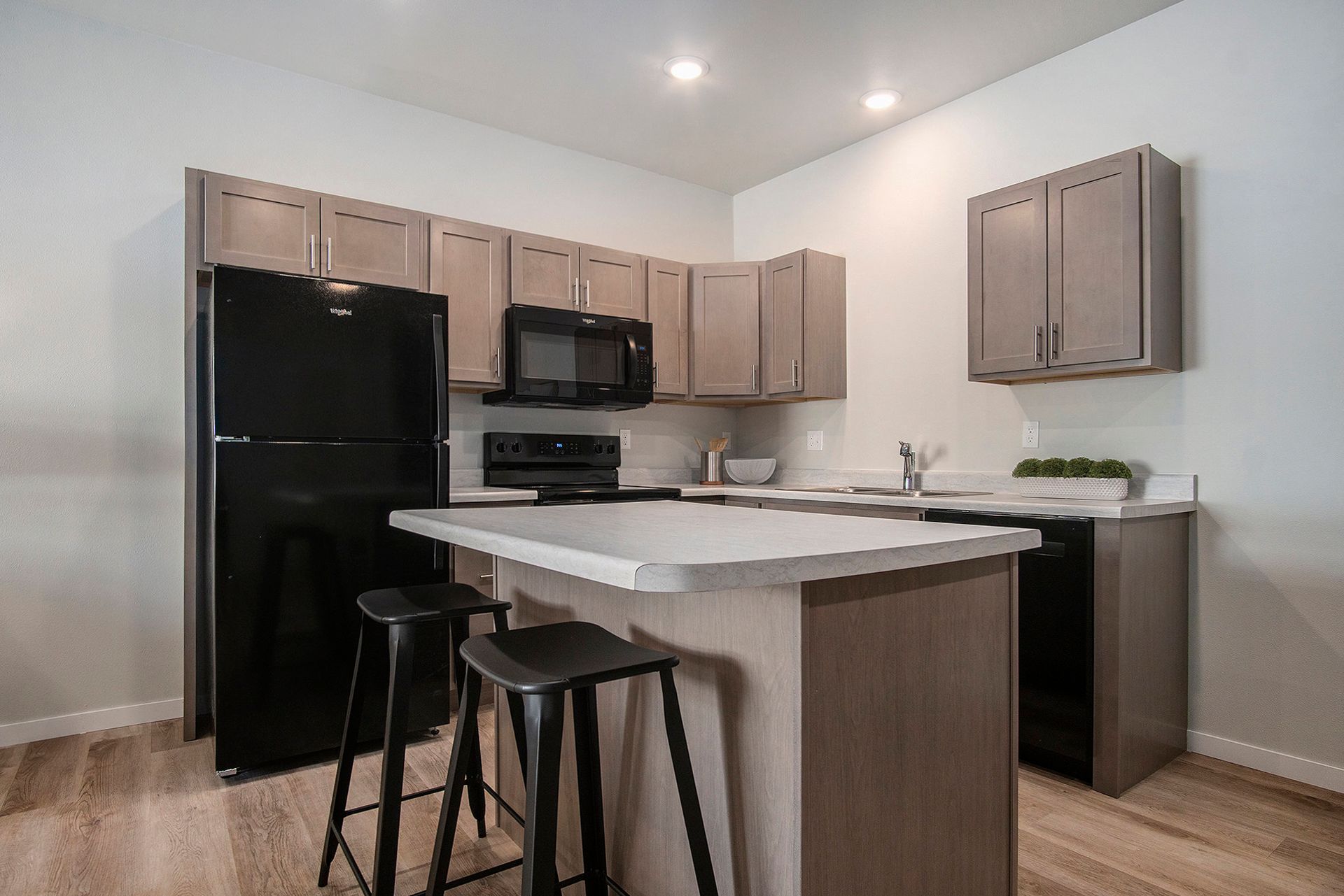 Kitchen with island and chairs.