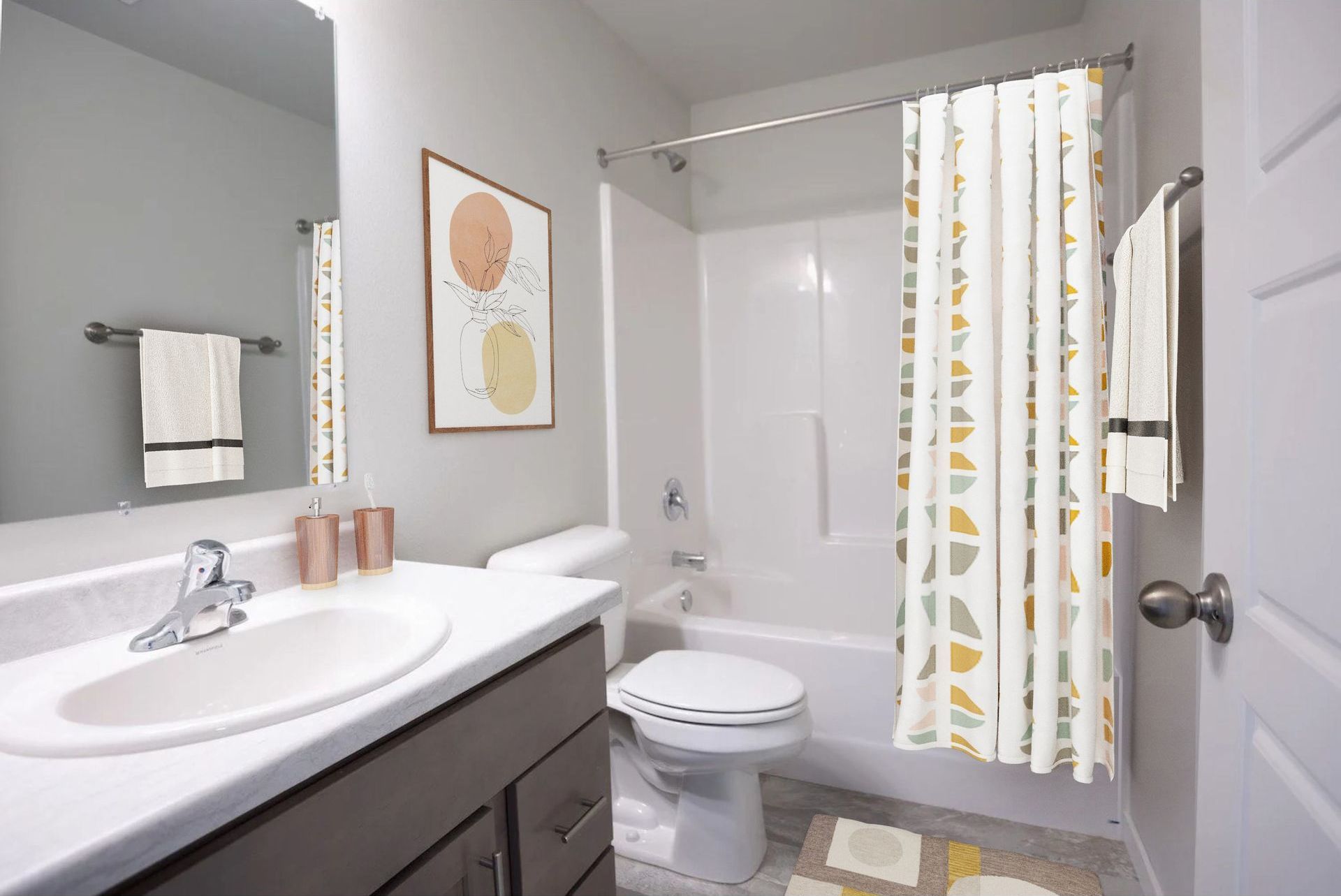 A bathroom with a sink , toilet , bathtub and shower curtain