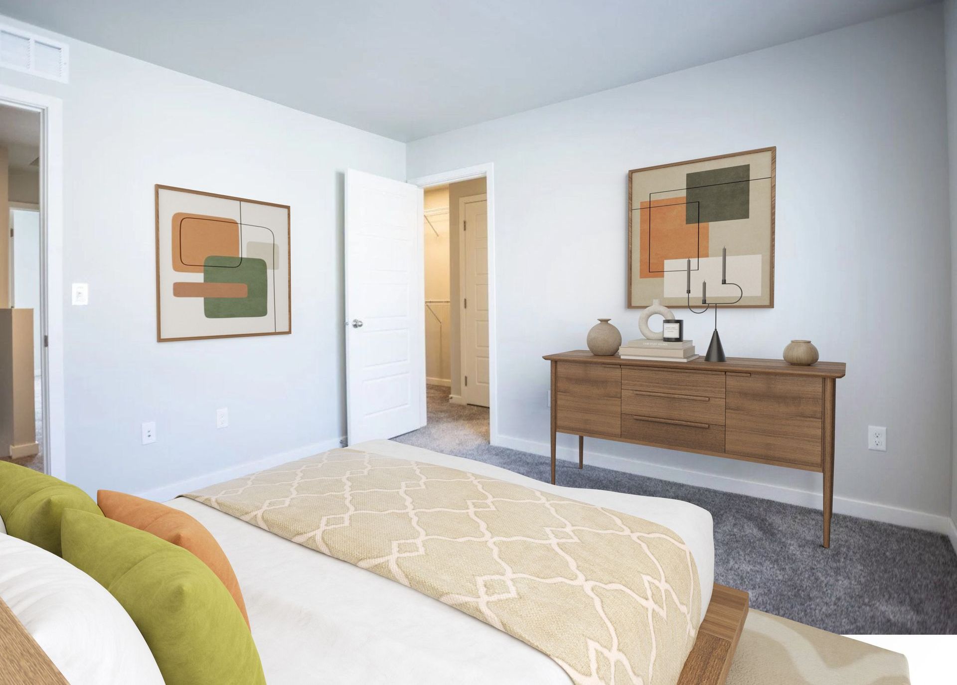 A bedroom with a bed , dresser , and two paintings on the wall.