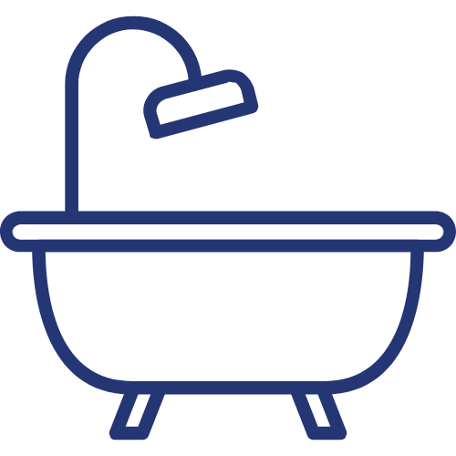 A bathtub with a shower head on top of it.