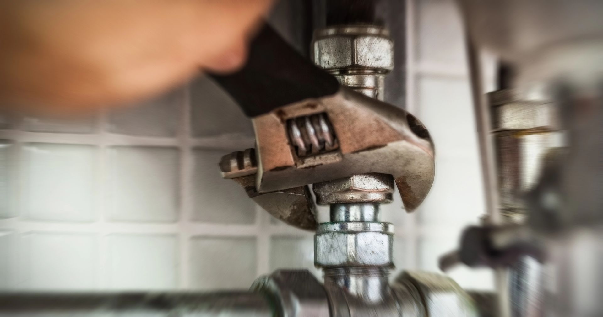 wrench on pipe fixing plumbing