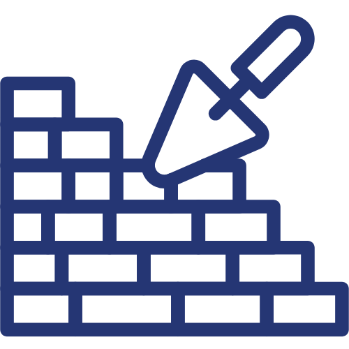 A trowel is being used to build a brick wall.